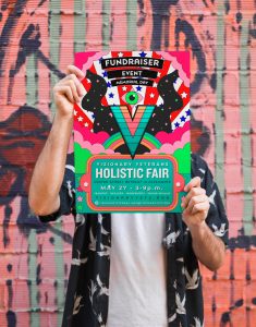 Visionary Veterans Poster being held up by a man